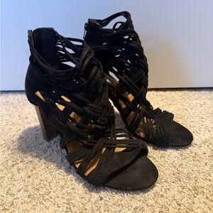 Women's black heeled sandals.